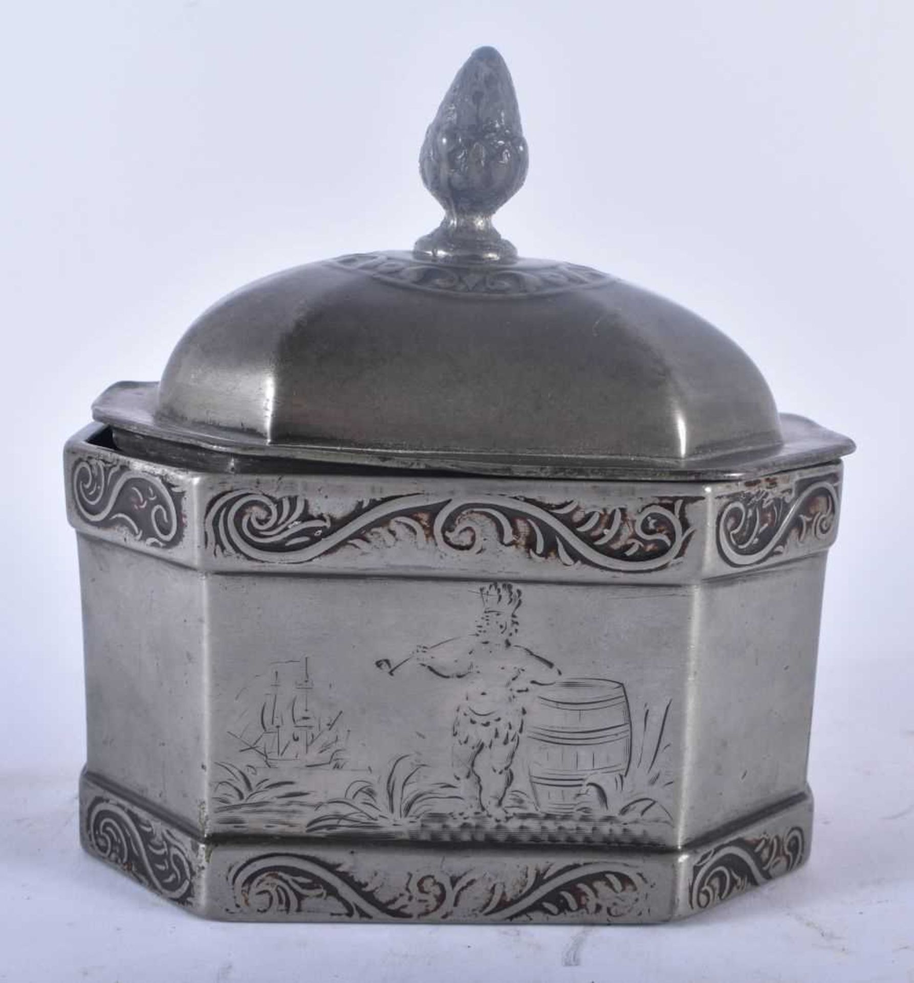 AN UNUSUAL ANTIQUE PEWTER TOBACCO BOX AND COVER engraved with a scene of a tribal male smoking a