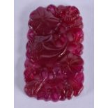 A CHINESE CARVED TOURMALINE PLAQUE 20th Century. 34.9 grams. 4.25cm x 7.25cm.