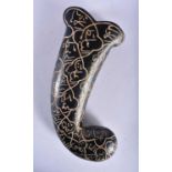 AN ISLAMIC MIDDLE EASTERN CARVED JADE DAGGER HANDLE decorated all over with calligraphy. 13 cm x 6