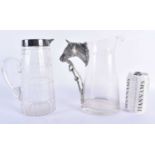 A SILVER PLATED GLASS PITCHER together with a horse head jug. Largest 22 cm x 17 cm. (2)
