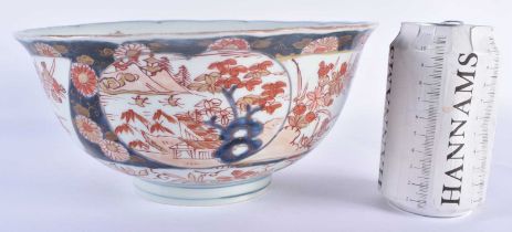 A LARGE 18TH CENTURY JAPANESE EDO PERIOD SCALLOPED IMARI BOWL painted with flowers. 24 cm x 10 cm.