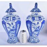 A LARGE PAIR OF 18TH CENTURY DUTCH DELFT BLUE AND WHITE VASES painted with birds in landscapes. 38