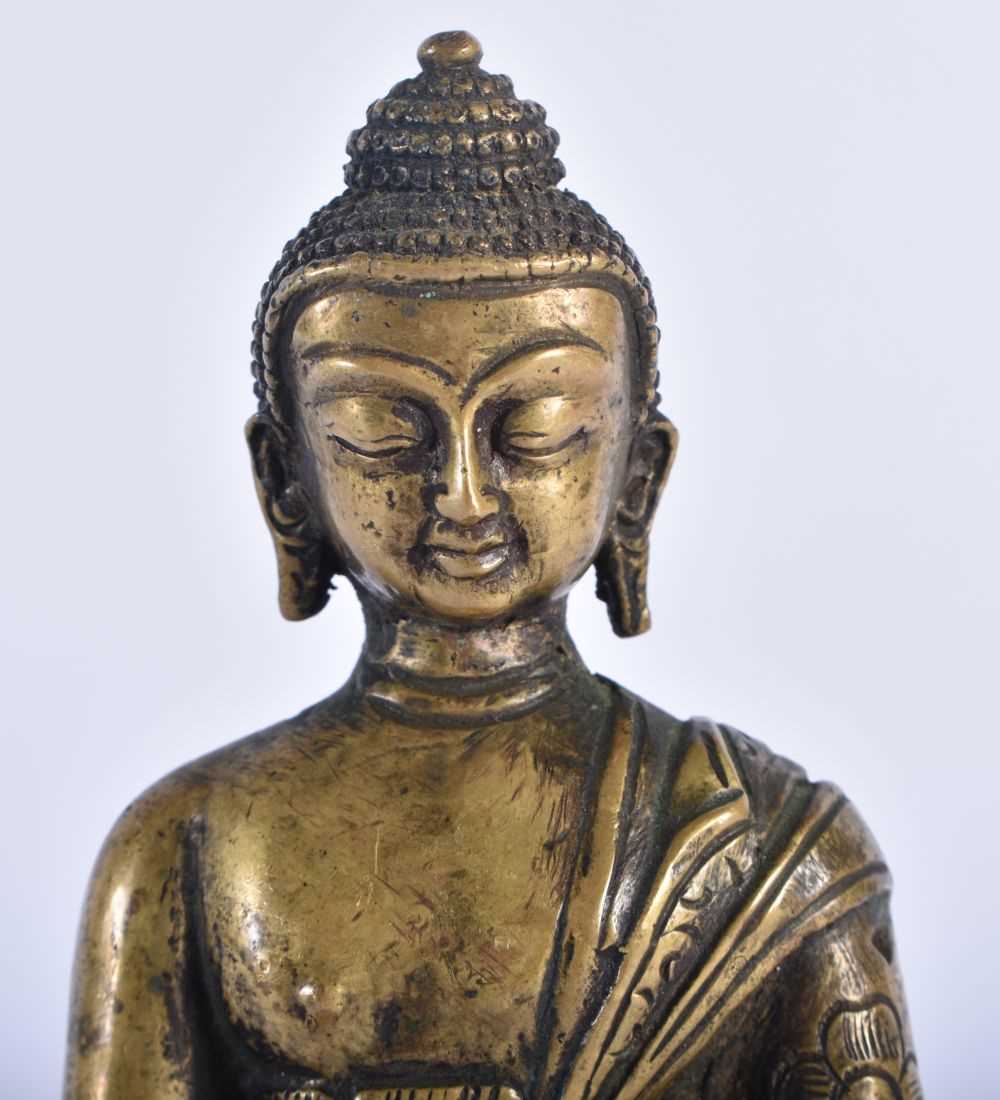 A 19TH CENTURY CHINESE BRONZE FIGURE OF A SEATED BUDDHA modelled upon a lotus capped base. 12 cm x 6 - Image 2 of 7