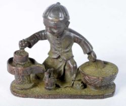 A Japanese Bronze of a Seated Boy Cooking. 7.5 cm x 5.9cm x 3.3 cm, weight 211g