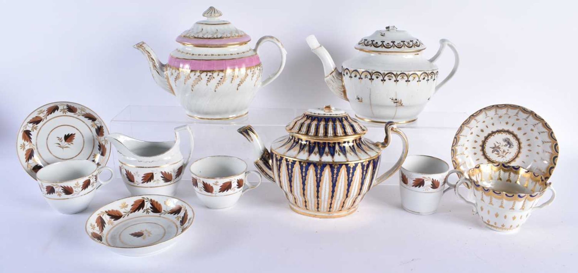 A GROUP OF LATE 18TH/19TH CENTURY CHAMBERLAINS WORCESTER TEAPOTS together with similar porcelain.