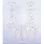 A PAIR OF REGENCY CUT GLASS DECANTERS AND STOPPERS. 28 cm high.