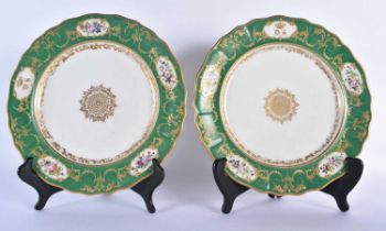 Early 19th century French pair plates with central gold medallion, a border with four gilt panels of