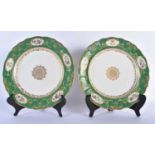 Early 19th century French pair plates with central gold medallion, a border with four gilt panels of