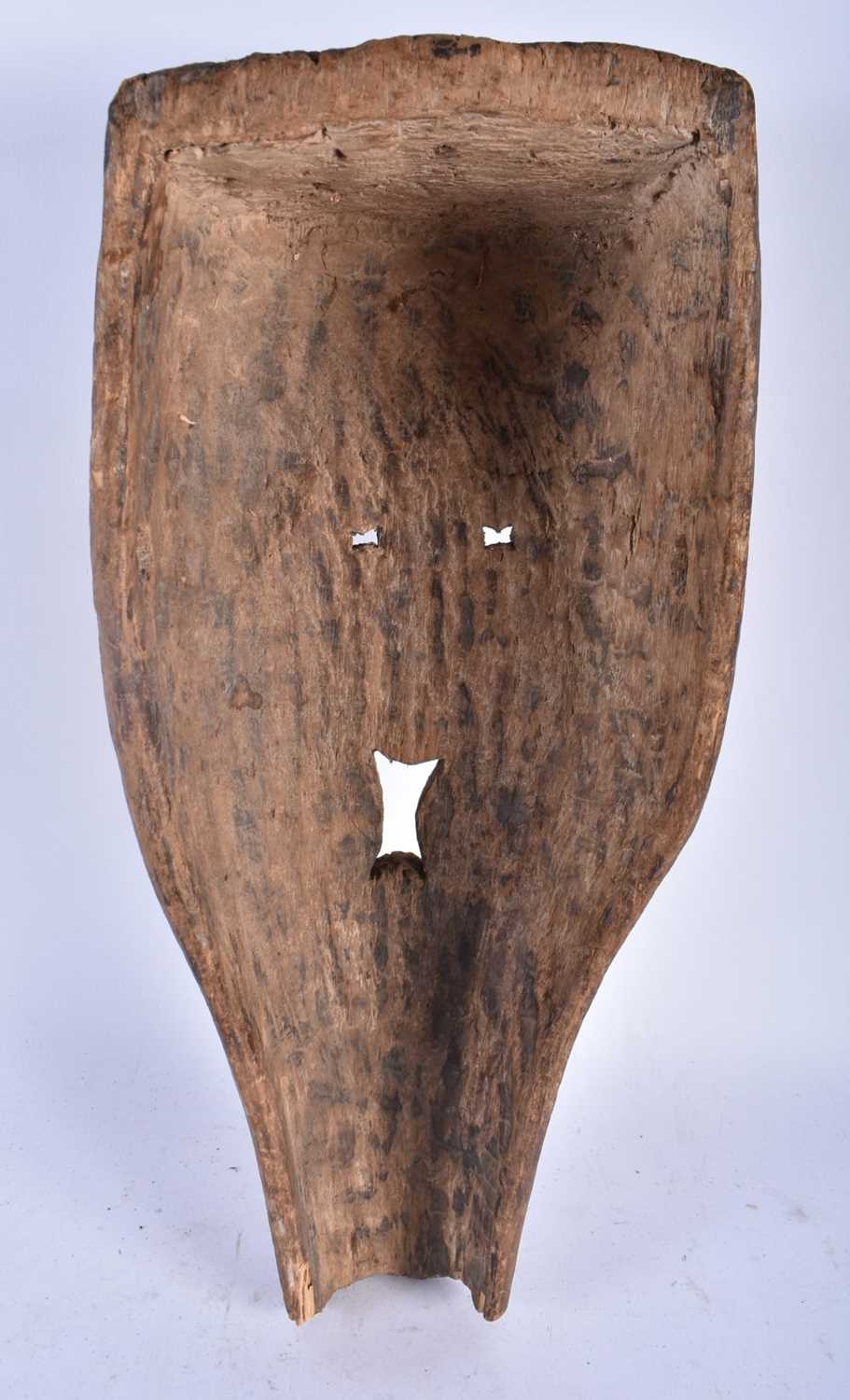 A LARGE AFRICAN TRIBAL CARVED WOOD MASK. 45cm x 20 cm. - Image 5 of 5