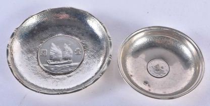 Two Silver Coin Dishes. 1 Stamped Silver. Largest 8.7cm x 1cm, total weight 60.9g (2)