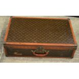 A Louis Vuitton suitcase 22 x 76 x 46 cm.