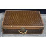 A Louis Vuitton suitcase 23 x 81 x 53 cm.