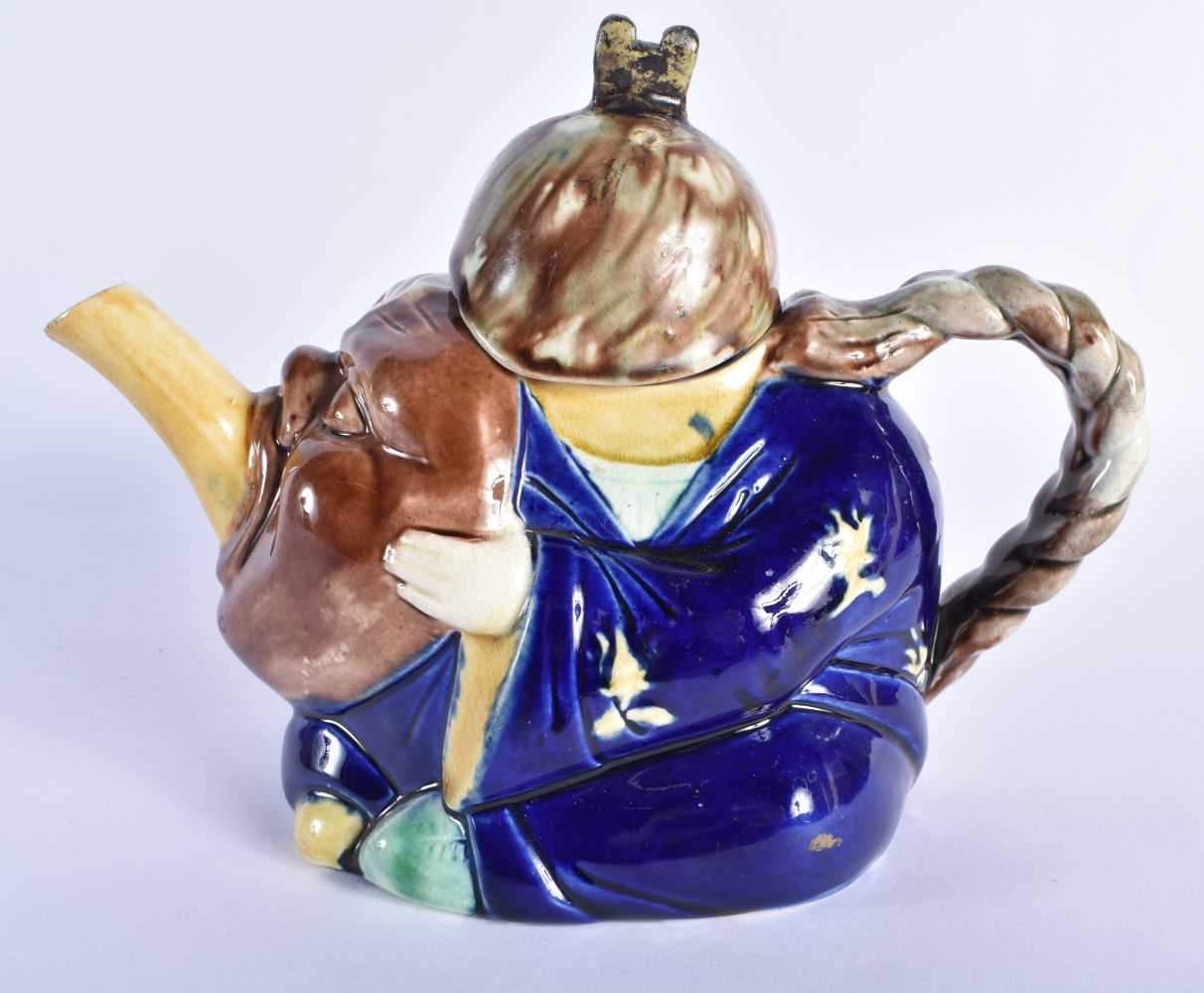 AN ANTIQUE MAJOLICA TEAPOT AND COVER formed as a Chinaman. 19 cm wide. - Image 3 of 6