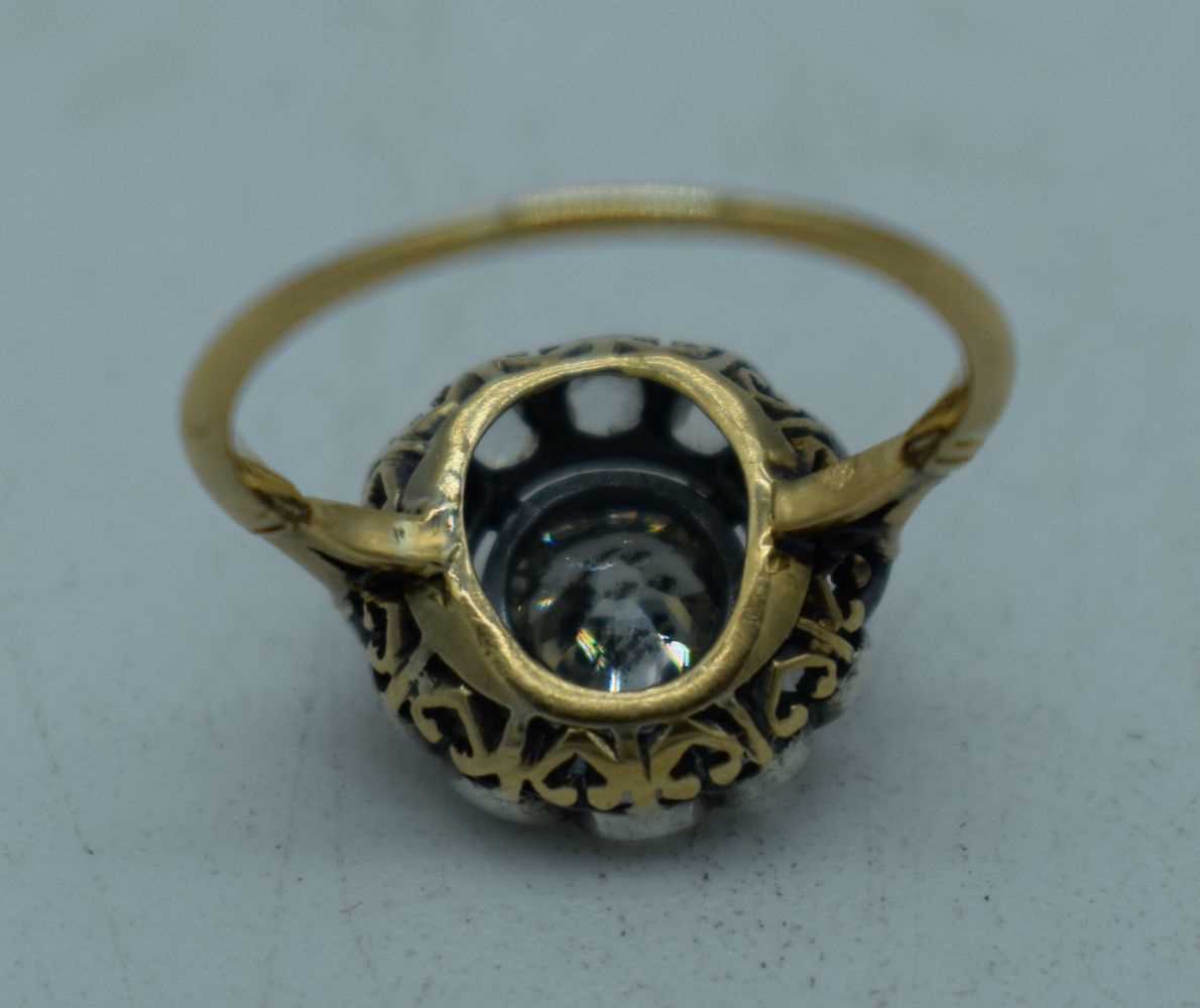 A LARGE ANTIQUE GOLD AND DIAMOND COCKTAIL CLUSTER RING. L. 2.3 grams. Central stone 0.5 cm x 0.5 - Image 3 of 3