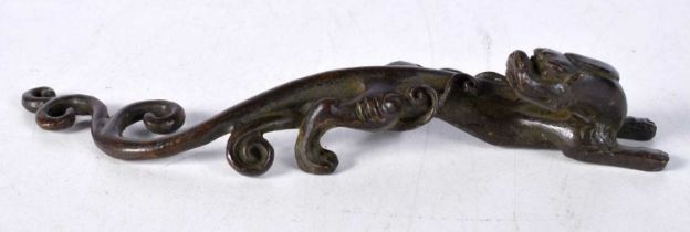 A Japanese Bronze Scroll Weight in the form of a Dragon. 16cm x 2.5 cm x 2.8 cm, weight 156g
