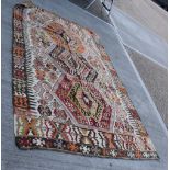 A Central Anatolian Keyseri Kalim Rug, made in two sections with geometric motifs 276 x 165 cm.