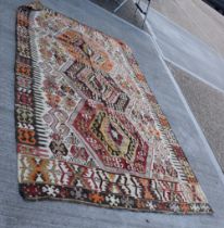 A Central Anatolian Keyseri Kalim Rug, made in two sections with geometric motifs 276 x 165 cm.