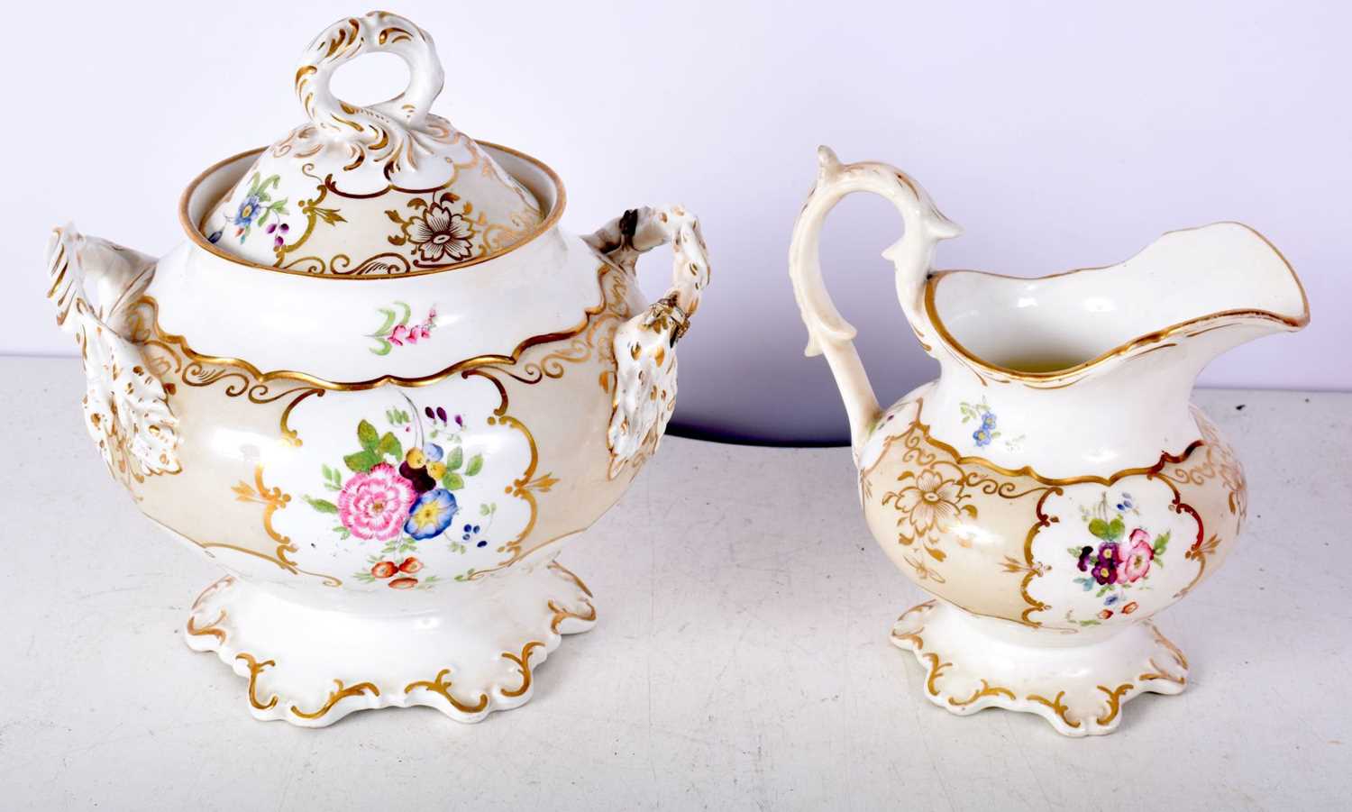 A 18th Century Rockingham porcelain Sucrier together with a milk jug both decorated with flowers - Image 2 of 6