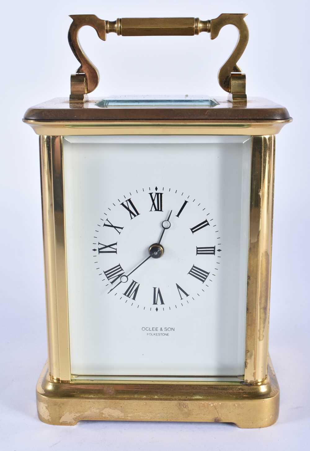 A OCLEE & SON CARRIAGE CLOCK. 17 cm high inc handle.