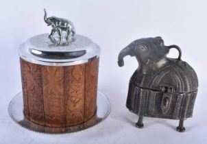 AN ANGLO INDIAN SILVER PLATED CARVED WOOD ELEPHANT BISCUIT BARREL AND COVER together with a bronze