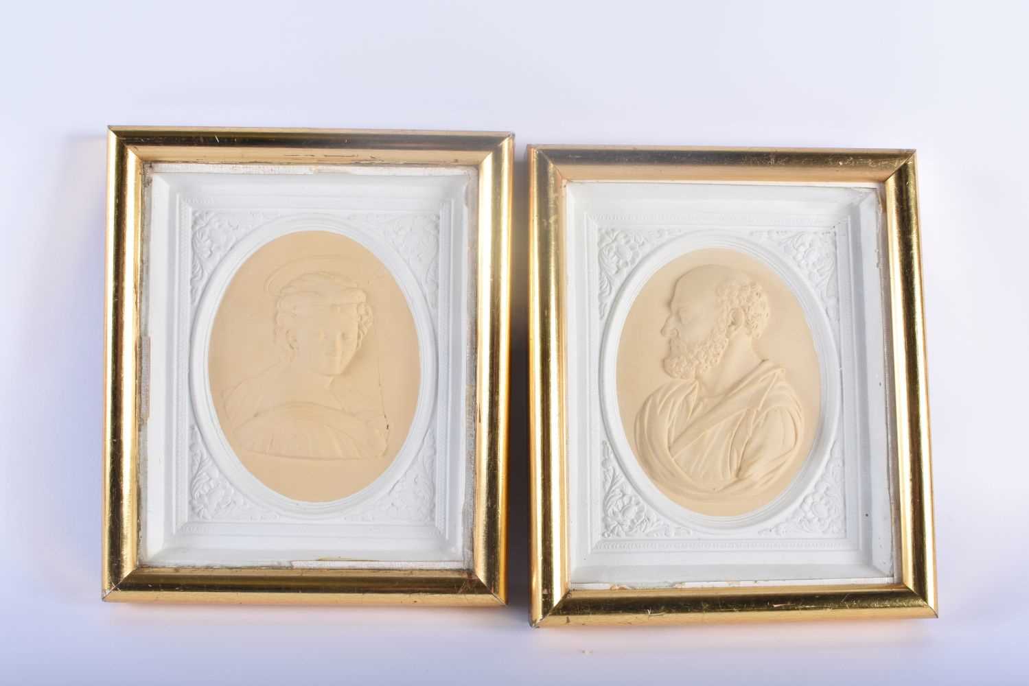 A PAIR OF 19TH CENTURY PLASTER COUNTY HOUSE CLASSICAL PORTRAIT PANELS within giltwood frames. 24