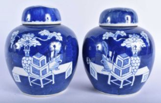 AN UNUSUAL PAIR OF 19TH CENTURY CHINESE BLUE AND WHITE PORCELAIN GINGER JARS AND COVERS Kangxi