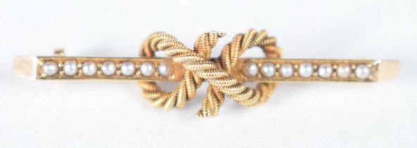 AN ANTIQUE 15CT GOLD AND PEARL BROOCH. 4.2 grams. 4.25cm x 1 cm.