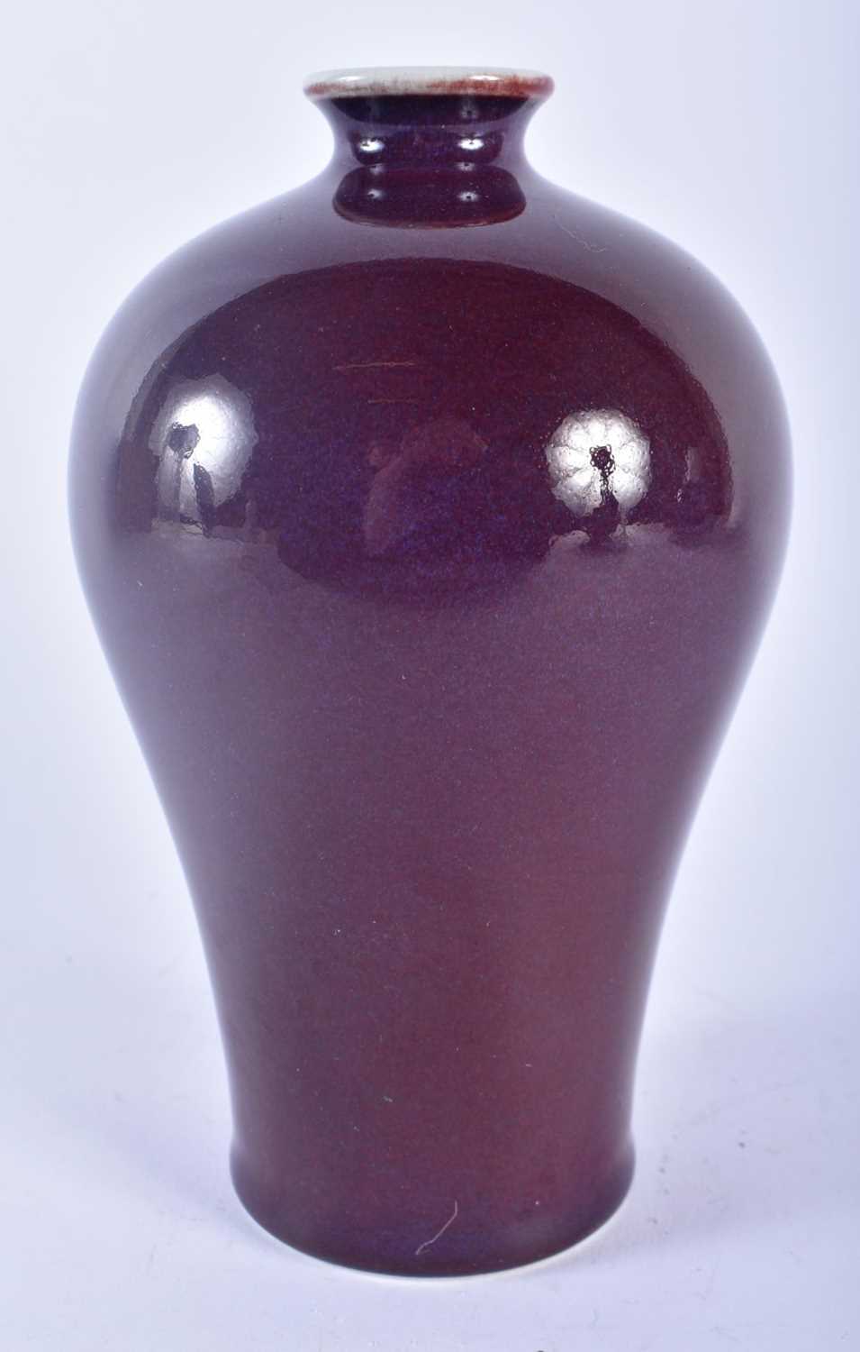 A CHINESE QING DYNASTY FLAMBE GLAZED PORCELAIN MEIPING VASE. 17 cm high.