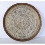 A large Central Asian embossed brass tray 48cm diameter