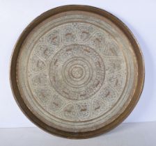 A large Central Asian embossed brass tray 48cm diameter