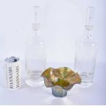 A PAIR OF RETRO GLASS DECANTERS AND STOPPERS together with an iridescent glass bowl. Largest 30cm