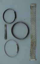 WHITE METAL BANGLES etc. 60 grams. Largest 5.5 cm wide. (5)