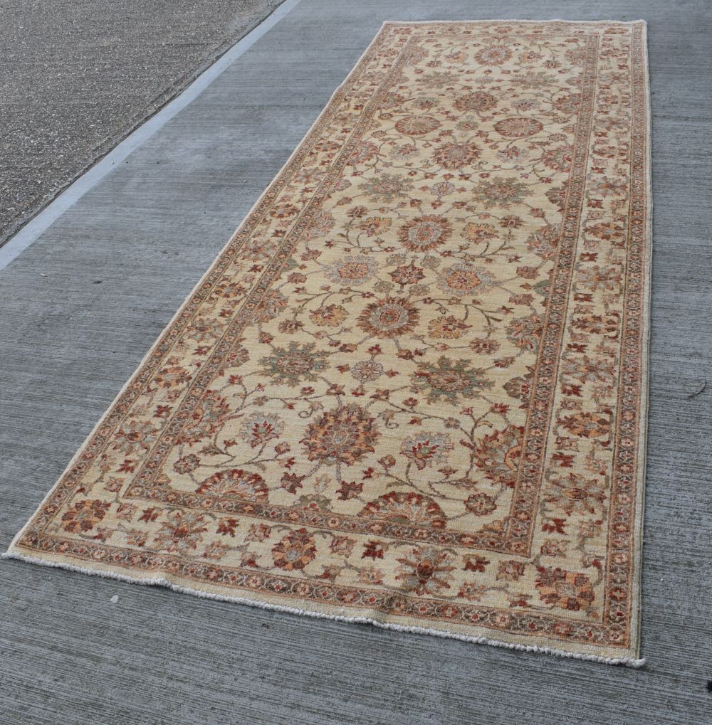 An Afghan Usak long rug 357 x 117 cm