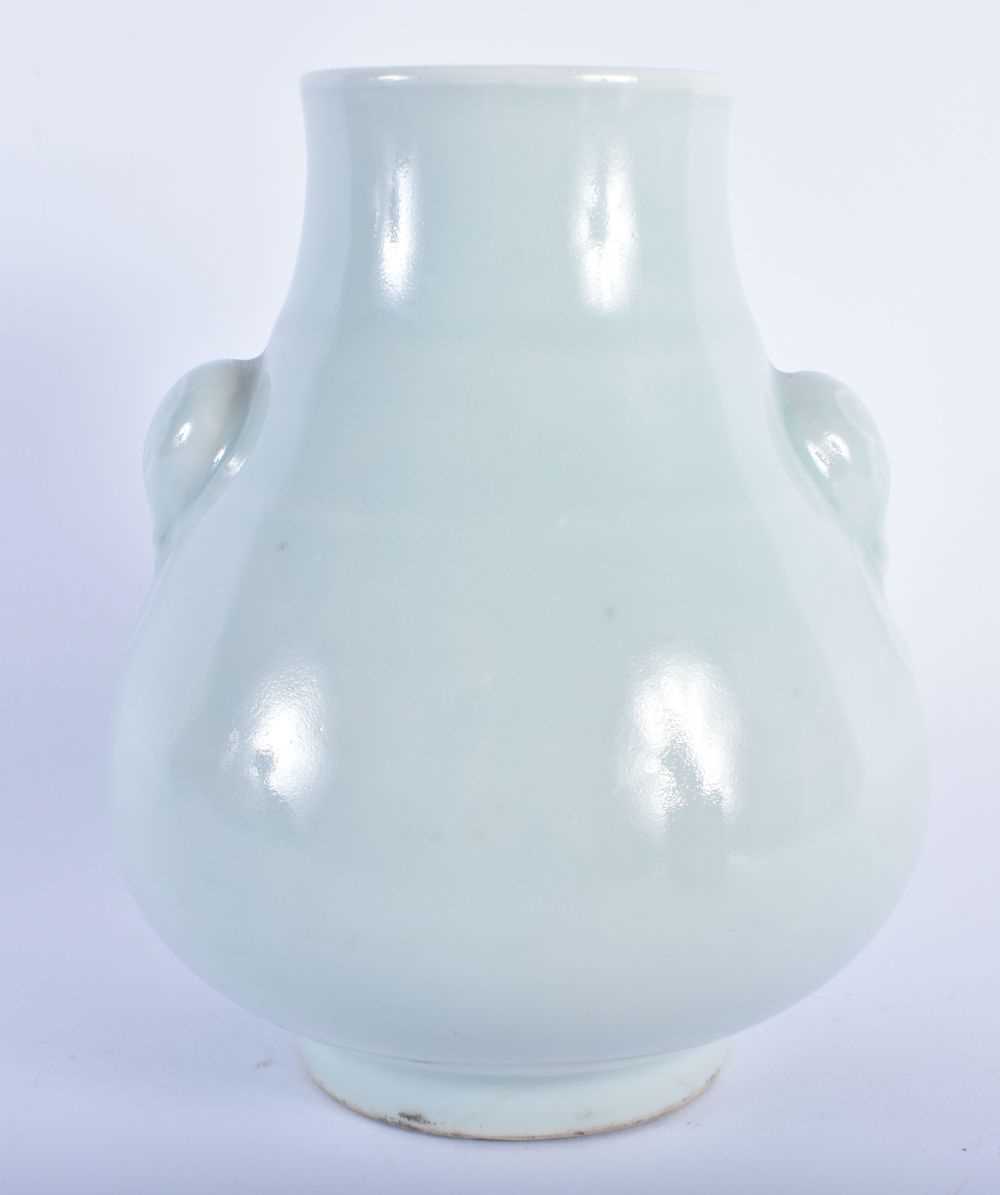 A CHINESE QING DYNASTY PALE CELADON GLAZED PORCELAIN HU VASE bearing Zhengde marks to base. 15.5