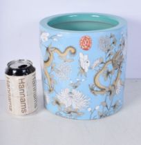 A Chinese porcelain Dragon brush washer decorated with a floral pattern in relief 20 x 19.5 cm.