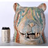 A large pottery Tigers head 31 x 28 cm.