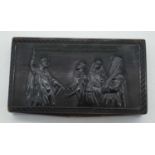 A 19TH CENTURY CARVED HORN SNUFF BOX AND COVER depicting four saints within a landscape. 9.5 cm x