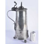 A LARGE ANTIQUE ARMORIAL PEWTER FLAGON bearing 1704 date to top. 48 cm high.