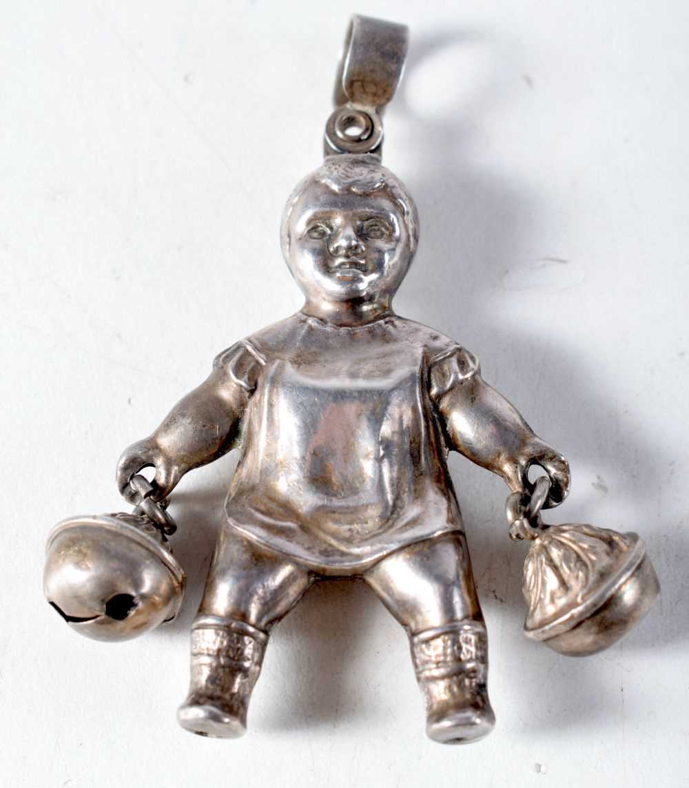 A Vintage Silver Babies Rattle Pendant in the form of a Baby holding Two Bells by Chrisford & Norris