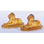 A PAIR OF ANTIQUE MUSTARD YELLOW PRESSED GLASS LIONS. 12 cm x 8 cm.