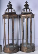 A large pair of metal and glass sectioned lanterns 88 cm (2)