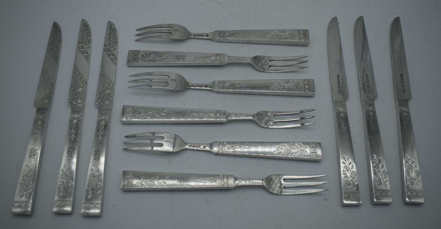 A SET OF SIX ENGLISH AESTHETIC MOVEMENT SILVER PLATED KNIVES AND FORKS. 426 grams. 19.5 cm long. (