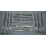 A SET OF SIX ENGLISH AESTHETIC MOVEMENT SILVER PLATED KNIVES AND FORKS. 426 grams. 19.5 cm long. (