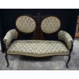 A wooden framed upholstered two seater sofa 104 x 136 cm