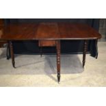 An antique mahogany drop leaf dining table 71 x 145 x 104 cm.