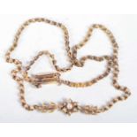 A VICTORIAN 15CT GOLD AND PEARL NECKLACE. 12.1 grams. 39 cm long.