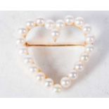 A 14 Carat Gold Heart Shaped Brooch set with Pearls. Stamped 14K, 2.9cm x 2.9cm, weight 5.2g