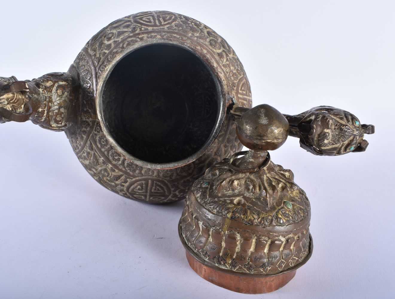 A 19TH CENTURY TIBETAN COPPER TEAPOT AND COVER decorated with repousse figures and foliage. 23 cm - Image 4 of 5