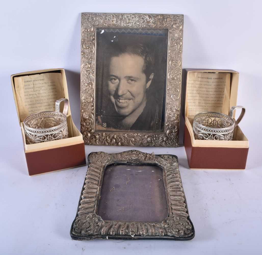 AN ANTIQUE SILVER PHOTOGRAPH FRAME together with another repousse frame & a pair of Russian cup