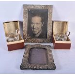 AN ANTIQUE SILVER PHOTOGRAPH FRAME together with another repousse frame & a pair of Russian cup